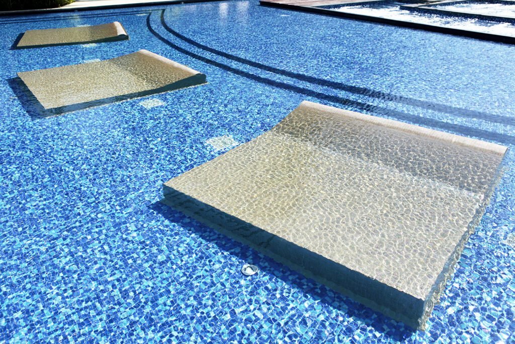 Top Signs Your Pool Needs Resurfacing and When to Act | Affordable Pool Repair Luxury pool sunbed float for relaxing in a renovated backyard swimming pool